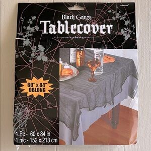 Black Gauze Tablecover 60" x 84" and 12 Silver Embossed Paper Doilies